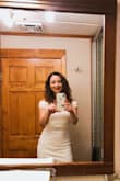 I love this dress, it fits perfectly. I wore it to a cruise event. The material is thick, not see through at all. Everyone loved it when I wore it! - Karem M.
