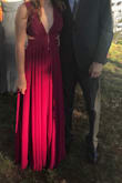 Wore this dress for a fall wedding in Charlotte. I usually wear a medium in a dress but for this one I ordered a small so the waist would fit tighter. I would say that it was true to size. My only complaint is that the color is not as pictured, it is more of a hot pink/fuchsia. Aside from that it was super comfy and fit like a glove! With my height I didn't have to wear heels and it perfectly touched the ground. Overall I loved it! - Alexa P.