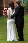 Once I tried this on I knew it would be my wedding dress. It was sleek and comfortable, showed off my curves without being overly sexy, and I didn't have to buy a special bra. The fabric has a slight stretch which I like. The back drape I needed someone to help me with, but that and the touch of lace added just enough detail for my taste. Got tons of compliments. - Katie T.