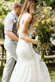 I wore this as my wedding dress! I couldn't bear to spend thousands on a dress for one day. This dress looks and feels like it's much more expensive than it is! I received so many compliments. I am normally an extra small at Lulu's so that's what I ordered as soon as it went in stock. This dress is a little more snug than others I've bought here, and I probably could have used a small instead but it wasn't in stock at the time. The length was perfect. This dress is gorgeous! The lace pattern is just beautiful. I definitely recommend this dress and Lulu's for inexpensive wedding gowns! - Ashley H.