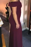 I ordered the dress in burgundy in a size Medium. It fits me like a glove, has a thick and flexible fabric and the color is beautiful. The length is perfect with 4 inch heels. I'm wearing the dress to a black tie optional wedding in late November and I can't wait to where it. I would consider ordering it in black just to have around. - Andrea P.