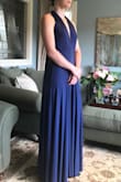 I loved that dress so much! Wasn't expensive at all, soft, comfortable and amazing quality! I love how you can tie it into all different tops, if I wasn't comfortable with one arrangement, I could go int the bathroom and I would come out wearing a whole new dress! I recommend this dress for people with B or C cups, it was really easy for me to use, being a B, but my friend who is a D cup had a little trouble with the top part. Overall totally worth your money! - Julia H.