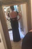 This dress is amazing. As a larger girl, I have difficulty finding dresses that are long enough and adore my curves. This dress does just that. I can't wait to be the maid of honor in this dress! - Logan F.