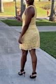 I wore this dress to my med school graduation and it was so comfortable. It didn't ride up at all and received many compliments on it. I'm usually a size 6 in dresses and the medium fit perfectly. It was just the right length as well. - Brittni R.