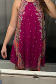 I really like this dress. I think the color is so fun and a different look for Spring/Summer. Like some of the other reviews said, the dress is a little thin and the arm holes are also low cut. I thought that the fit and the length are perfect! - Regan D.