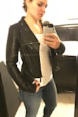 This jacket is super cute. It really looks and feels like leather. It runs small so I'd definitely size up. I usually wear a medium in tops and ordered a large. It's actually still tight through the shoulders and arms but it's comfortable enough I don't have any issues. It's also a little more cropped than I expected. I have a long torso so I'm sure that's part of it. Overall I love the jacket! - Kayti M.