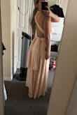 Purchased this as a bridesmaids dress. It fits PERFECTLY! Super stretchy and comfortable, but also holds up a larger bust. Soft fabric, perfect length. Sooo happy with it! - Julie T.