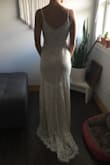When I ordered this I was hoping it could be a potential wedding dress, but didn't want to get too excited because the price was too good to be true. I figured if I didn't love it I would wear it to my shower. It arrived pretty quickly and the second I tried it on I was obsessed!! It's absolutely beautiful and so well made! This is going to be my wedding dress! I ordered size small because I didn't want to risk it being too small. It is a tiny bit big around my waist so I will have it altered before my wedding day to fit me perfectly and add a deeper V in the back. The lace detail is absolutely gorgeous and it is fully lined. I love the small train and the detail around the bottom.  I'm so happy with this purchase and I saved a fortune!!! Thank you lulus! You rock!! - Shelby I.