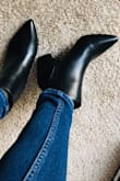 After reading the reviews on this booties, I've decided to purchase a black pair. I'm usually a size 6.5 but got the 7 because of the pointed toe, knowing I'd wear these with socks (normal usual running socks), I'd need some space without cramping. Got them a day early and tried them on. They fit perfectly, they weren't too tight nor too loose, easy for me to take them off without struggling and putting them on was a breeze as well. Definitely recommend these to anyone. - Rafhanah P.