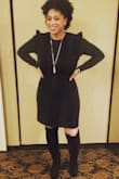 I could've bought a medium for a tighter fit but I love the looseness in the large. Very form fitting and cute. Pairs great with tall boots. Wore the dress to a 60th birthday party and received a lot of compliments. Definitely was a great buy! - Ajene N.