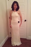 This dress is beautiful and exactly as described. It's a bit confusing to put on with the criss-cross straps; but lovely once on. Only problem is that the scallops on the front like to curl up. P.S. I did not have shoes on in the photos; will be more reasonable on length with heels. - Kim H.