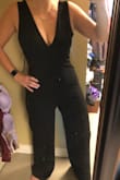 Hugs all the right places. Has some stretch in the fabric. Is long but with heels will look even better. The front and back V are quite low so my regular bra shows the strap in the back a little, so I will use a V front backless sticky bra. So pleased how this looks and feels I immediately ordered another jumpsuit different style. This is my first order of Lulus. It also came really fast. - Shandra F.