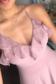 This dress is so flattering and pretty on! It has the perfect amount of flow, and the straps are adjustable for my shorter torso. It fits perfectly, so I'll be wearing it for a March wedding! The color looks more purpley in some light and more pink in darker light. It's a very light mauve. - Katherine P.