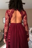 This dress is so beautiful, detailed and vibrant!!! Love that merlot color. I will warn it runs long, I will have to wear 4 inch heels. The arms were tight but luckily I could safely stretch the lace. Also raising my arms is a bit difficult. I love this dress though!!! - Celina W.