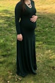 Bought this dress to wear to a fancy winter wedding. I'm 6 months pregnant and this dress was the perfect thing to wear! It was stretchy and clung to my curves in all the right ways. I did order a Small and a Medium but stuck with the Medium. The Small fit, but I didn't want it to be obscenely tight over my bust and bump. You probably will want to wear a smoothing garment underneath. I did have the dress hemmed about a 1.5 inches and wore it with 2.5 inch heels and after all that it was the perfect length for a shortie like me. Also folded up the sleeves a little but you can also push them up. The slit came up high but not too high - just perfect! Highly recommend this dress!! - Lindsay B.