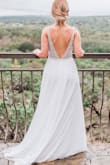 I purchased this dress for my wedding and I could not have been happier! It is even more gorgeous in person than in the photo and the intricate bead work makes it look like it came from a high end boutique. I am blown away by how perfect this dress worked for my special day. It was just slightly big on me, so I did take it to get tailored. The bottom skirt half is also pretty sheer, so I did get a solid slip to wear underneath. Thank you Lulus! - JoAnne Q.