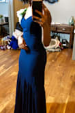 I got this dress for a wedding and it was absolutely perfect. It fits true to size. The material is very high quality. The color was very rich as well. I received so many compliments on this dress. - Kierstein A.