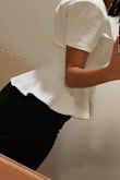 The material is good, doesn't feel cheap. Elastic and very comfortable. It's feminine. I love this top. - Diego S.