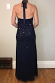 I bought this dress for a work Christmas party. It hugs in all the right places while allowing you to breathe. Perfect for the dance floor!. No alterations were needed.  So pleased with this dress. - Sandra S.