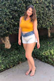 I am usually a size M in shirts, but since I knew this was a tight fitting crop top and I have a bigger chest I ordered a L. It is still very cropped, but I LOVE it!! I wear it so much, it's very flattering and comfortable and I wear it with no bra (even better). It's great with shorts and even jeans and a denim jacket with ankle booties! - Kami C.