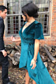I wore this dress to a London wedding in October and it was PERFECT! Such a gorgeous and lush colored fabric, and I received compliments ALL NIGHT!  It's so beautiful that I bought one for my sister too! Get this dress! YOU WILL LOVE IT!!! 
Side note: You MUST STEAM this dress before you wear it, but once it's done you will really see how gorgeous this dress truly is. Also, I tried on the small as well, but it was a bit baggy for my frame and looked more like a robe than a dress. If you're around my size go for the X-Small. - Marysa C.