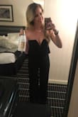 The V can be a little deep if you have a larger chest. Even wearing very high heels I was still walking on the bottom of the pants so I had to have it hemmed. I still love it though! - Erin M.