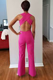 This jumpsuit is great. Love the color. Just as pictured. No zippers. Just pull it on. It has an elastic waist. It was a little loose in the chest area. I may have been able to order an XS, but I feel that the hips would be tighter than I would have wanted, so I will keep the small. Feels good against the skin. I would say that if you are short-waisted then this would not be a good look, and if you are 5'5" or below you should have the hem adjusted. The inseam is 34 inches. I usually wear a 31-32" inseam, but was wearing 3" heels in the pics. Hope this helps.... - Kimberli D.