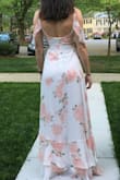 Wore this dress to my bridal shower. So many compliments. It fit perfectly. You can not wear a typical bra with this due to the back. Also, I did have to wear a tiny wedge heel (maybe an inch) so the material didn't drag. - Sarah S.