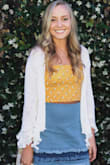 SUCH a cute top! Not too revealing with really bright colors and a flattering fit. Looks adorable with a skirt, jeans, or under overalls. - Taylor H.