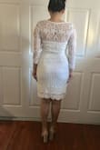 I bought this to wear to my courthouse wedding. This actually looks better in person. The fit is a bit odd on the shoulders/neckline, but I think a little hollywood tape would do the trick. The fit is a bit snug on the body but looks good enough. - Cherry D.