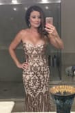 I wore this stunning gown to a black tie gala and felt so beautiful. I always like to step out of the box and find dresses that no one else has and this was definitely one of them. I was stopped all night long and so many people have asked where I bought my gown at. It was a show stopper indeed! - Jenee R.