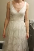 I love the dress style overall and can't beat the price! Not a fan of the tulle overlay; but the neckline, back, belt, and lace are beautiful. I'm planning to use this as my wedding dress after some alterations. The dress is very snug around the waist, but matches the size chart accurately. - Lynn M.