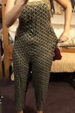 So excuse my poorly taken photos. They're just to help others with a similar body type get an idea. 
I loved this jumpsuit in theory and the print and all, but man did it just fit funky. I am always a medium in Lulus, but this isn't Lulus brand. Maybe that was the problem. 
The fabric was bunchy and wavy pretty much from bust to crotch and it is because there is an unflattering seam down the middle that also cheapens the jumpsuit. 
The other really weird thing was this excess fabric on either side of the hips. It was kind of like they were going to put pockets in and then didn't. It is really unflattering. Lastly, I'm 5'8 and I wasn't wearing heels or anything, but the jumpsuit seemed too cropped and more cropped than it did in the photo. 
Overall, this look may be better for less curvy women, but I just can't imagine the side excess fabric on the hips would looking flattering on anyone. 
Unfortunately I bought this on final sale so I can't return it, otherwise I 100% would. - Rebecca V.