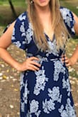 I love this dress because it's so comfortable and easy to wear! I've already worn it to my friend's wedding, a friend's rehearsal dinner, and date night with my man.
The slit is subtle and I tied the dress so that it's covered unless I sit down. I just made sure to keep checking on it, and then for photos you can open it up a bit.
I'd say that by Lulus standards this dress runs a little large (I also don't have a lot of bust for my size, I'm 36 B 1/2, so maybe it's just me). But I'm glad it ran large because then I can pull it in a bit more than the model.
The sleeves might not be everyone's fave.
And I'm 5'7" and wore it barefoot and it was just grazing the floor. Not really an issue though - Marianna H.
