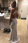 This dress looks so lovely on. I feel like it's high quality and I feel classy and sexy in it. It's a little big on me even though I ordered a size xs. It's also very long. Even with my tallest heels, I still need to get it hemmed. I'll be wearing it to my rehearsal dinner. - Lauren P.
