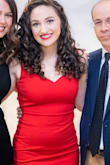 Wore this for our company Christmas party and loved it. Definitely short but I felt modest enough that I wasn't uncomfortable. The material is light but doesn't seem to show off every flaw. My fiance loved it on me. :) - Elyse K.