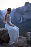 Dress fits true to size; extra long so had it altered slightly. Fabric is rich and heavy. Feels and looks like a more expensive dress. Held up well along the hike to our ceremony location! - Brit N.