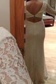 Thicker fabric for a colder wedding day. I ended up not liking how the back design sat on my body. The shoulders sat a bit wide on me as well. Overall, it fits well and is nicely made! - Ashley P.