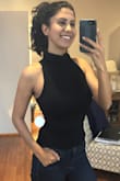 I love love love this! The fabric is really soft and not sheer. The turtleneck opening is a little tight, as it should be, while youâ're putting your head through. But once over the neck it's perfect! Just make sure to do your hair AFTER putting it on if you're doing an updo ;). I love the sophistication of this top and the sexiness of the cut and shoulders showing. Definitely get this one! - Sarah S.