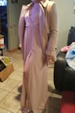 OMG this dress is so elegant and has a nice flow for when you move or dance around. It was easy to put on and take off, you can either slide it up or slip it on over your head. This dress does not have any zippers or buttons and the waist is elastic, so even though I normally wear a large in shirts and a 12 in jeans I decided to go with a small. I also saw on other reviews that the dress runs large. I needed to wear a safety pin so that my bra didn't show and it could stay in place, but that's only because I have a small bust. I would definitely buy this dress in other colors! - Jasmin M.
