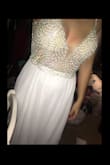 I absolutely love this dress. I will be getting married in April. I love that the beading is heavy. It shows that the material is super nice. The dress was really long and the straps need a bit of adjusting, but those are the only things that needed altered. It's a very comfortable dress. Pictures do not do it justice. It's so so stunning - Mackenzie R.