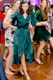 I loved wearing this dress to a wedding just this month. The fabric is beautiful and subtle if you're someone who likes very deep tones. Tends to come about a bit darker in some lighting, but excellent quality and the fit is true to size. A little baggy for smaller chests, but not to a negative degree. I got so many compliments on my dress, and I easily danced the night away with no issues! (: - Brittney W.