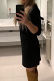 After reading the reviews I was nervous this dress might be tight fitting. I've purchased several size small Lulus dresses and have experienced both the dress feeling too tight and too loose. Overall I would say this dress is pretty loose and comfortable. Perfect for work or for a night out. It's definitely my go to look when it's cold out! - Jennifer C.