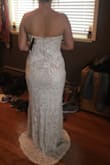 I absolutely fell in love with this dress! I could not stand the thought of paying 1500 plus dollars for a dress I would wear for 1 day. Great quality and people cannot believe it did not come from a high end bridal shop. I am adding a belt to it to add some of my wedding colors and have to get the bottom hemmed which is standard for me and dresses. 
You will not be disappointed. - Lo W.