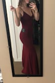 I bought this dress for a military ball and after reading the reviews I decided to go with a size S because it is supposed to be a tighter fit (I am normally a size M in Lulus dresses). I tried it on and it fits like a glove! I would definitely recommend downsizing if you are looking for a snug fit, it has a bit of stretch to it as well. I don't even need to wear a bra with it, though I'll likely wear stick-ons. I am so happy with this purchase!! - Shannon S.