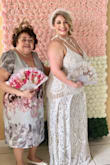 Excellent material, beautiful design, with the right undergarments even a bigger woman like me can wear it and still feel and look pretty. I used it for my vintage bridal shower, everyone loved it. The lower part of the dress will bring out your belly (for those that have a belly) unless worn with a body shaper. The color is perfect, high quality materials with a bit of stretch. Highly recommend, definitely bridal and lovely! I'm super happy with my purchase! - Carmen P.