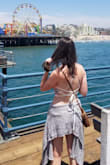 The quality of the material is great. It is thick so you won't be needing a bra at all. The strings were too long so I cut them a little bit. Waiting for summer to wear it again - Andrea G.