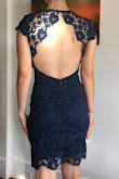 I LOVE the detail on the back of this dress. Unfortunately, the lace panels/straps on the back were quite large on me (even in an XS). I would have to take the lace pieces in about 1-2 inches on both sides, which would greatly diminish the look of the design on the back (in my opinion). I also didn't love the fit throughout my body for my proportions (mostly shoulders and mid section), at least looking at it from the front. According to the size chart, I should be a small so I ordered this in S in dark green and XS in navy, and I'm returning both. 

Also, the color of the dark green was beautiful and I wish it would have fit but the lace was weirdly less quality than the navy and had a lot of pulls throughout it (maybe it had already been returned?). - Alexis D.