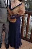 I ordered a large, knowing I would need alterations on the length for sure, but I wanted to make sure it wasn't too tight. In addition to taking off some of the length, I altered the shoulder area as well.

I was very impressed with the outcome and the quality of the dress! - Kimberly K.