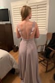 This dress is super flattering and will be very easy to wear with sticky cups, petals, or even braless. I need to get it hemmed significantly because I am pretty short, but other than that, it is very flattering around the waist and does not flare out around hips. Straps are very mildly adjustable, but they work well how they are. It's really pretty, flattering, and comfortable! Cannot wait to wear for wedding. - Wendy G.